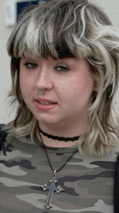 Girl with black hair and blonde highlights