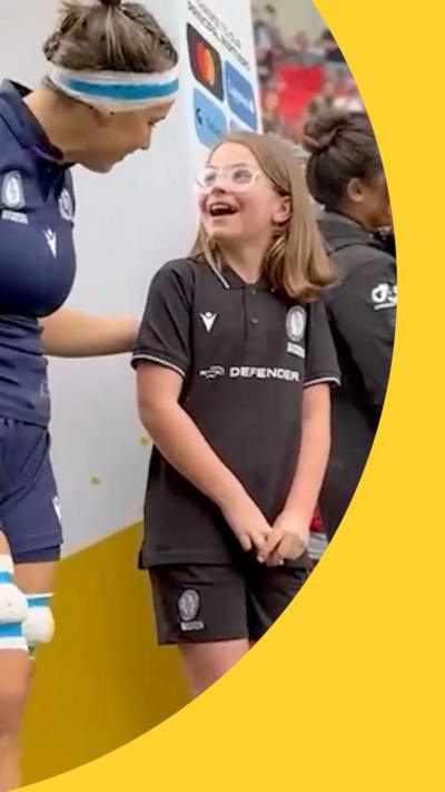 Rugby maso meeting Scotland player. She looks very excited! 