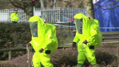 Police in hazard gear.