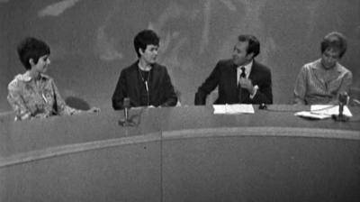 Kathleen Peters, Daphne Cohen and Irene Greaves sit at a desk with their interviewer