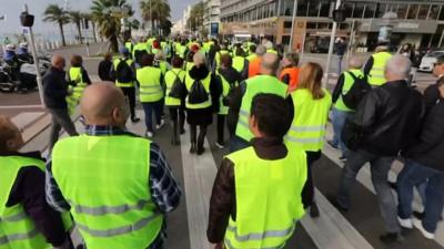 Protesters in high-vis vests