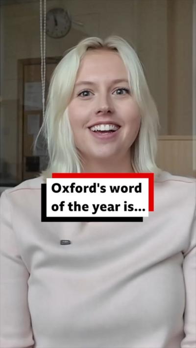 Woman with short blonde hair smiles at the camera.