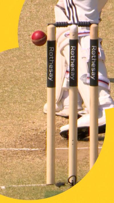 the ball clipping the top of the stump