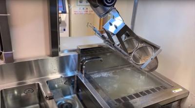 A robot cooking noodles