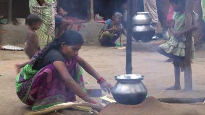 Woman with cookstove