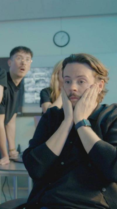 Man holds his face in his hands