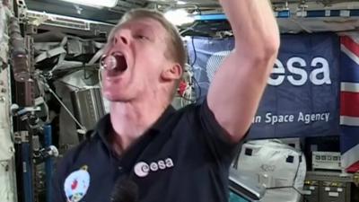 Tim Peake drinking water in space
