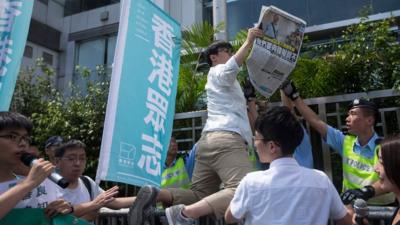 A protest outside China's Central Government's Liaison Office in Hong Kong, China, 17 June 2016.