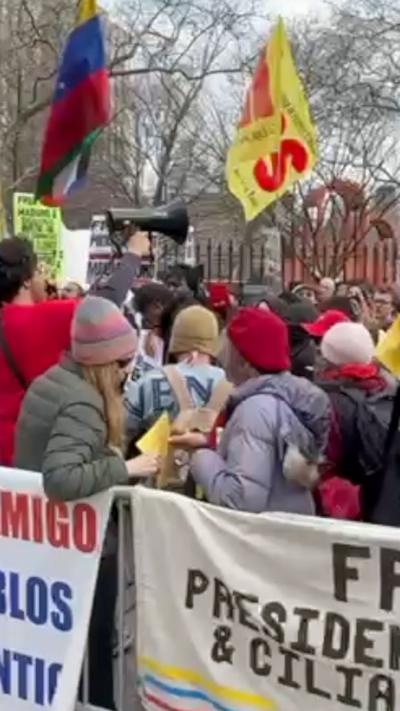 People protest at Maduro trial. 