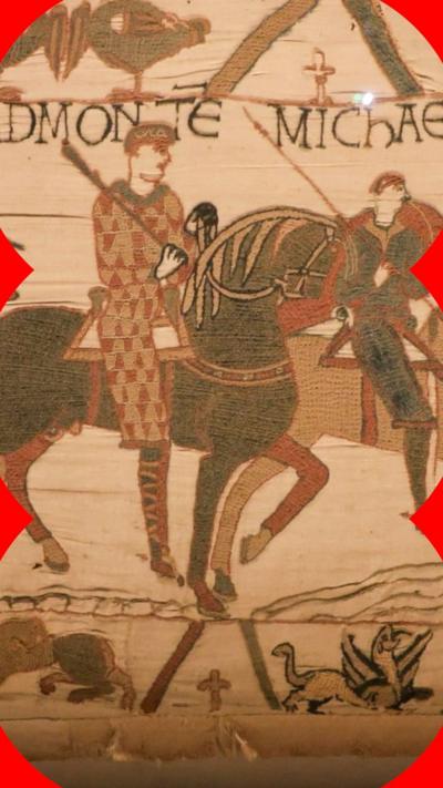 A close-up shot of the tapestry showing a man on a horse