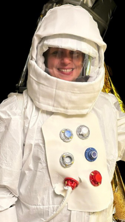 Woman in a white spacesuit and helmet. 