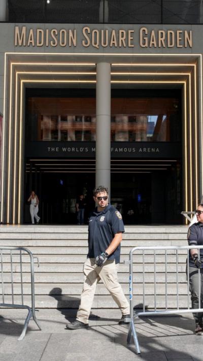 A police officer standing in front of MSG