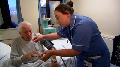 Nurse treating patient