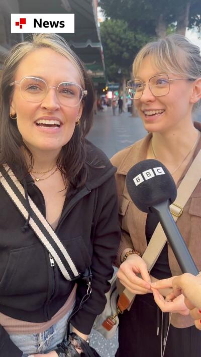 Two women being interviewed on the Hollywood Walk of Fame