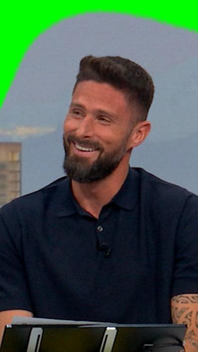 Olivier Giroud smiles during conversation
