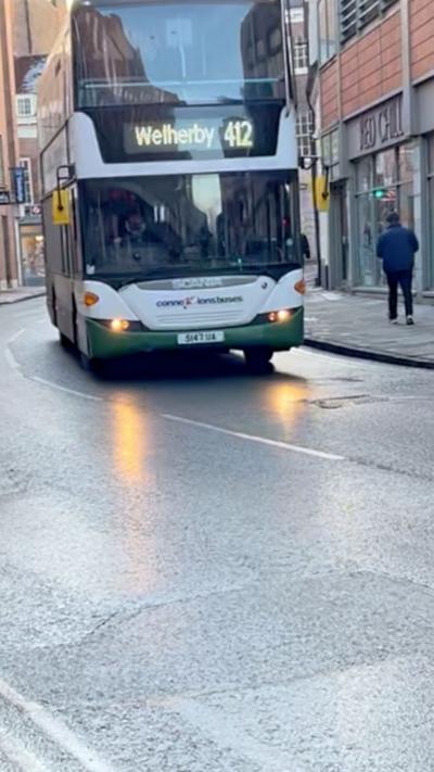 A bus driving down Rougier Street in York