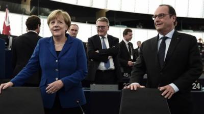 Angela Merkel (l) and Francois Hollande