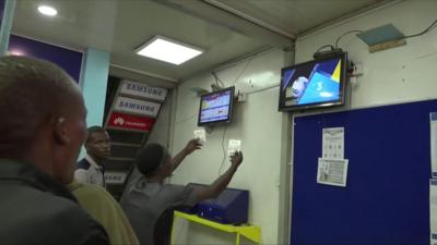 Punters in a betting shop in Kenya