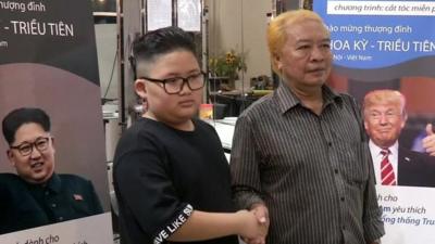 People with their hair styled as Kim Jong-un and Donald Trump in Hanoi, Vietnam