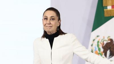 Mexican President Claudia Sheinbaum leaves the room as an earthquake interrupts her daily press briefing.