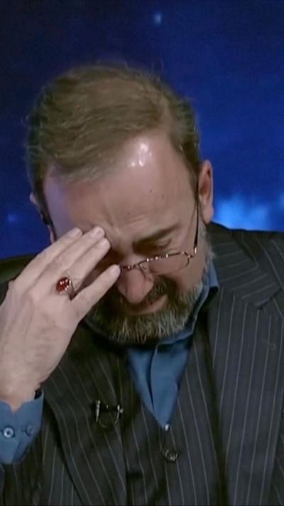 IRINN presenter with head in his hands