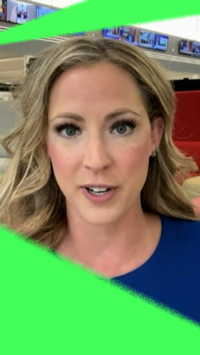 Woman with long blonde hair and blue top