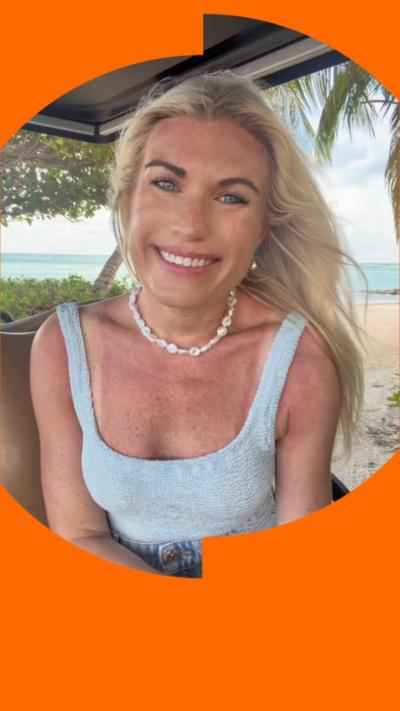 Hattie Underwood has long blonde hair and is wearing a light blue top.