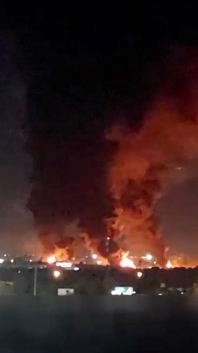 Flames and smoke in night sky