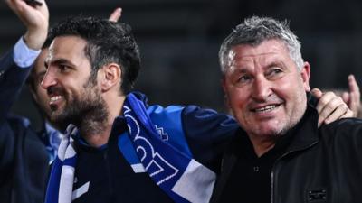 Como's Cesc Fabregas and Osian Roberts celebrate promotion