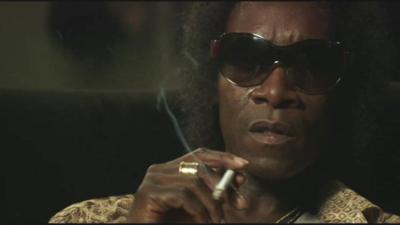 Don Cheadle as Miles Davis