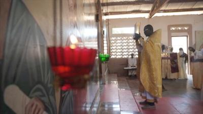 Priest at the front of an orthodox church