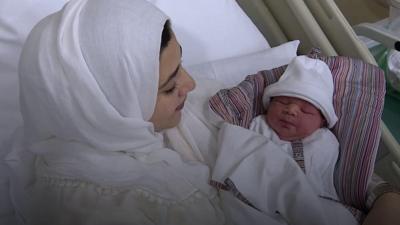 Moaza Al Matrooshi holds her baby