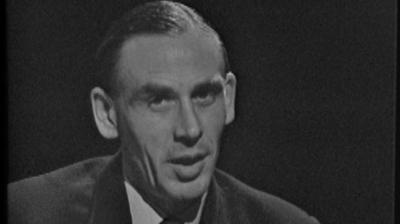 A close up of George King speaking in the studio.