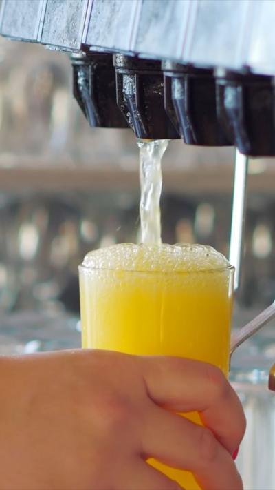 A drink being poured from machine