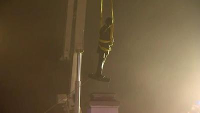 A Confederate statue is removed.