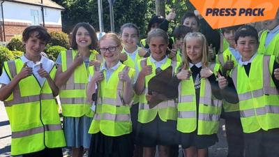 kids in high-vis vests