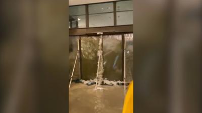 Water blasts through hotel doors