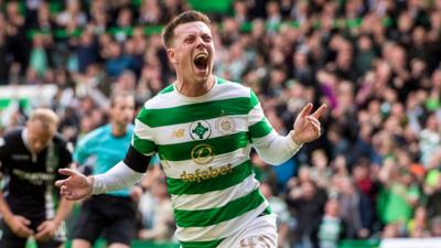 Callum McGregor celebrates scoring a late equaliser for Celtic against Hibernian