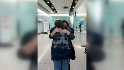 Sara Assayed hugging her mother