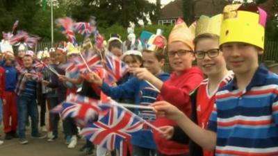 Children celebrate the Queen's birthday