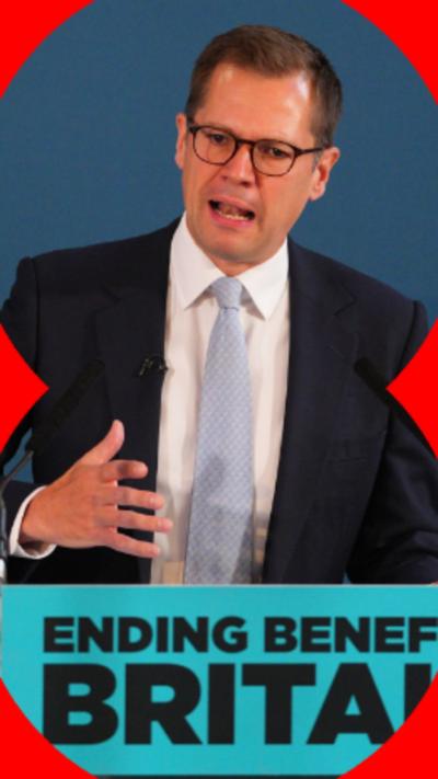 An image of MP Robert Jenrick while talking, wearing a suit and light blue tie.