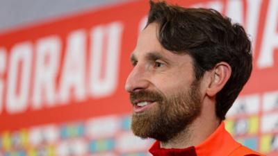 Joe Allen speaks to the media