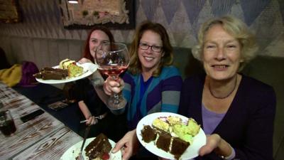 Bake Off fans holding cake