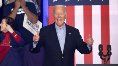 Joe Biden in front of American flag