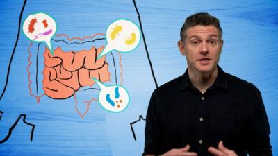 Man looking at the camera with an illustration of a stomach on his right
