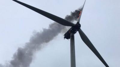 Wind turbine on fire.