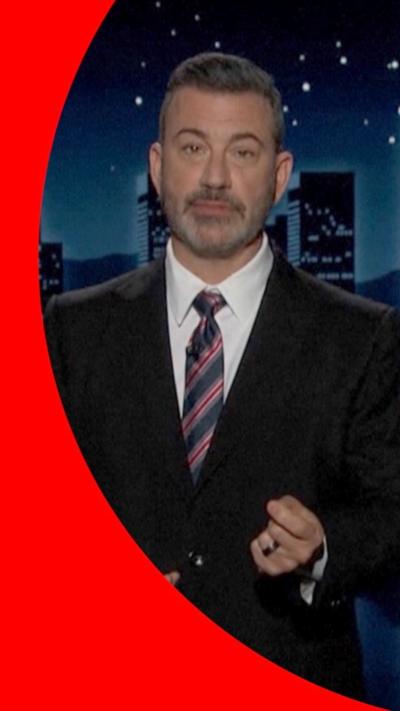 Jimmy Kimmel in a suit and tie, on air.