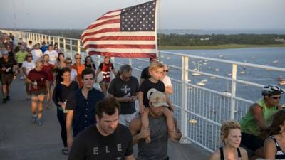 People marching on a bridge in Charleston, South Carolina