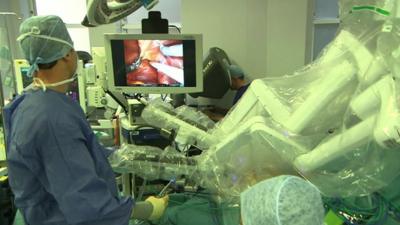 Robot being used to assist with a medical procedure
