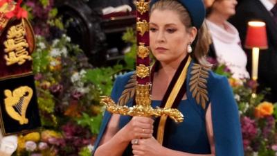 Penny Mordaunt carrying sword in coronation